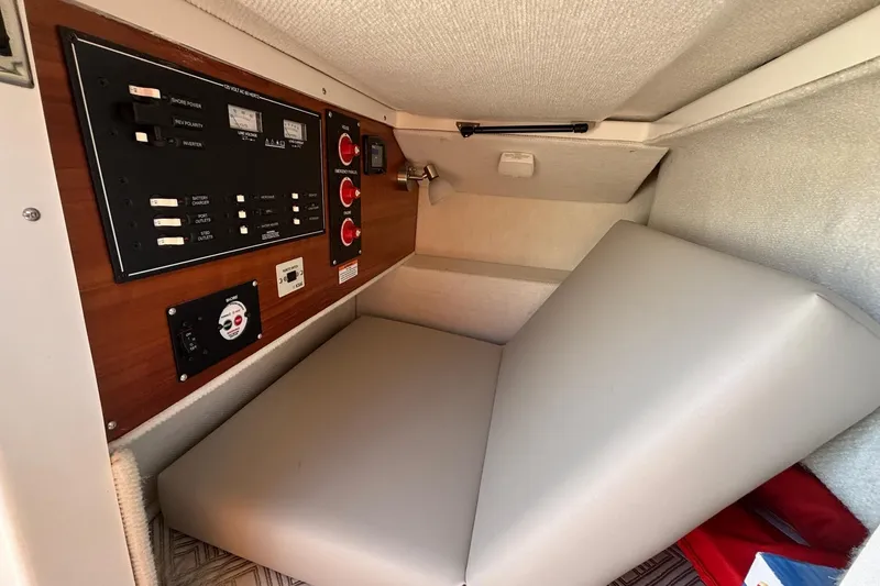 Slide: The Image of 2022 Cutwater C-248 Coupe interior with control panel and cushioned seating. - 23