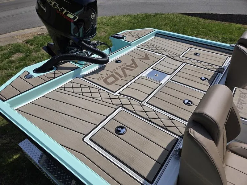 Slide: The Image of 2025 Avid 18 Vertex boat deck with storage compartments and motor, featuring sleek design. - 3