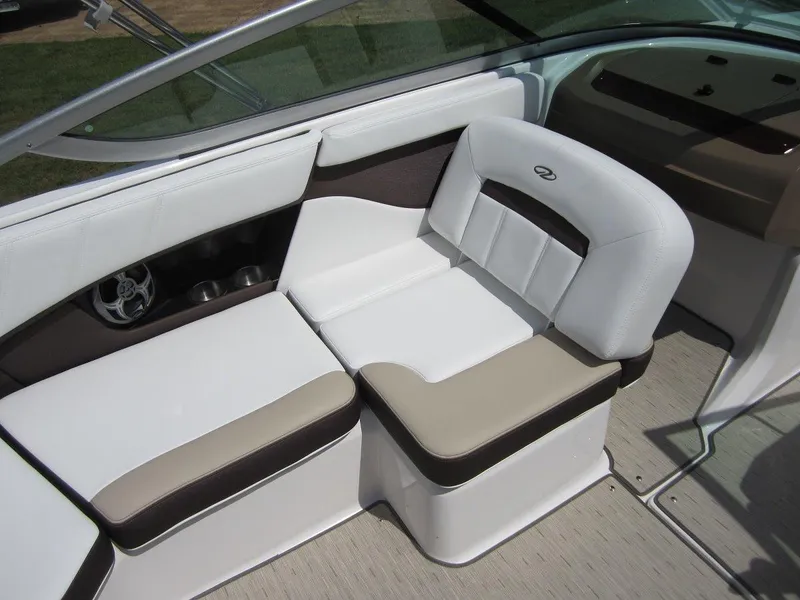 Slide: The Image of 2015 Regal 2000 ES boat interior with white and beige seating. - 10