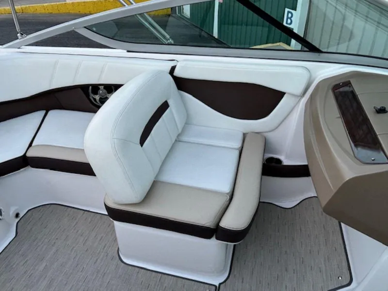 Slide: The Image of 2015 Regal 2000 ES boat interior with white and brown seating. - 18
