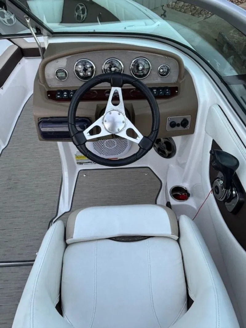 Slide: The Image of 2015 Regal 2000 ES boat interior with steering wheel and dashboard controls. - 19