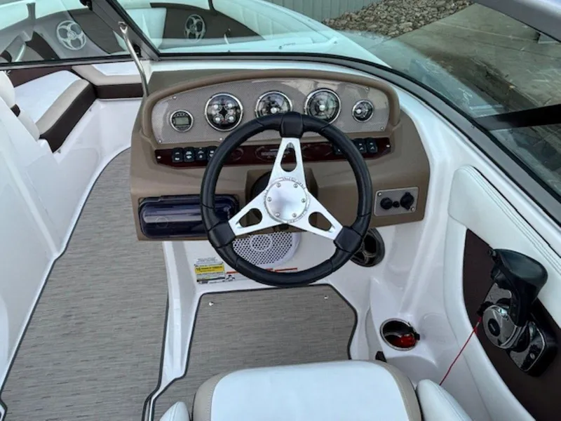Slide: The Image of 2015 Regal 2000 ES boat dashboard with steering wheel and instrument panel. - 20