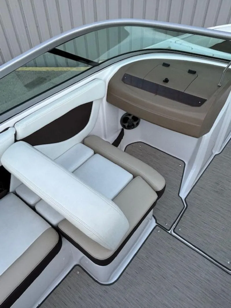 Slide: The Image of 2015 Regal 2000 ES boat interior with beige and white seating, modern design. - 21