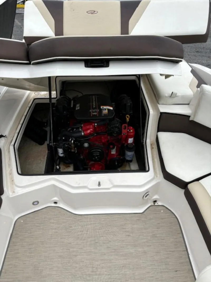 Slide: The Image of 2015 Regal 2000 ES boat engine compartment with seating and storage. - 24