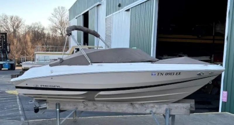 Slide: The Image of 2015 Regal 2000 ES boat on a trailer outside a storage facility. - 27