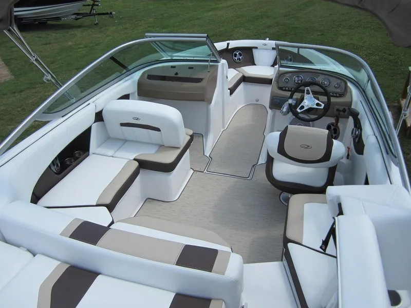 Slide: The Image of Interior of a 2015 Regal 2000 ES boat with white and brown seating. - 8