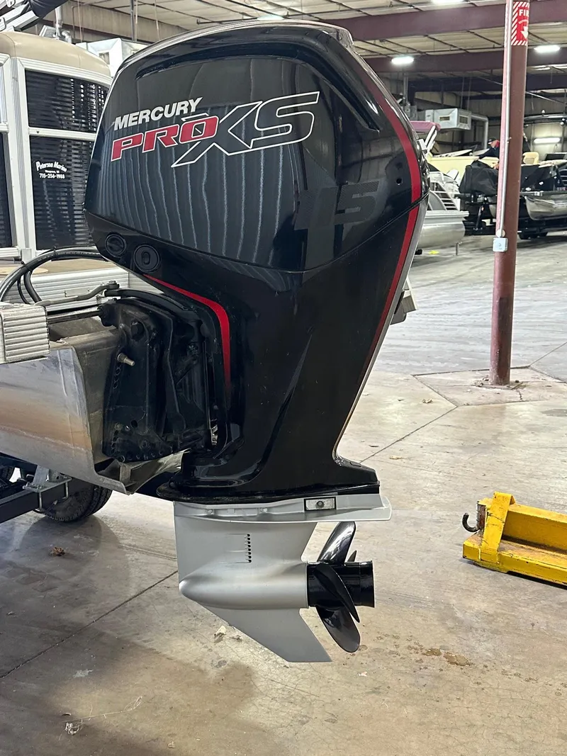 Slide: The Image of Mercury Pro XS outboard motor on 2018 Bennington 21 SSRCX boat in a workshop. - 13