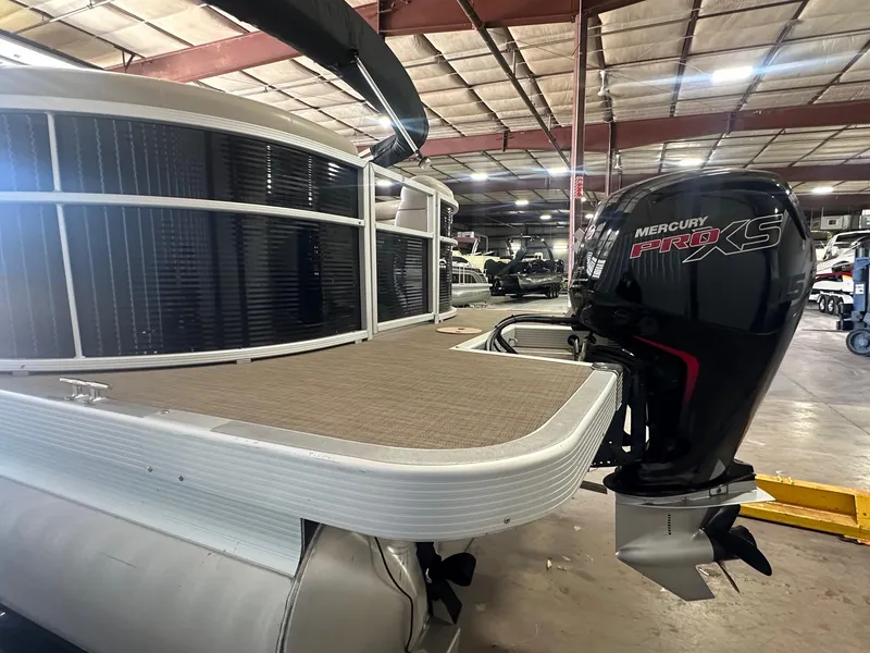 Slide: The Image of 2018 Bennington 21 SSRCX pontoon boat with Mercury Pro XS engine in a warehouse. - 14