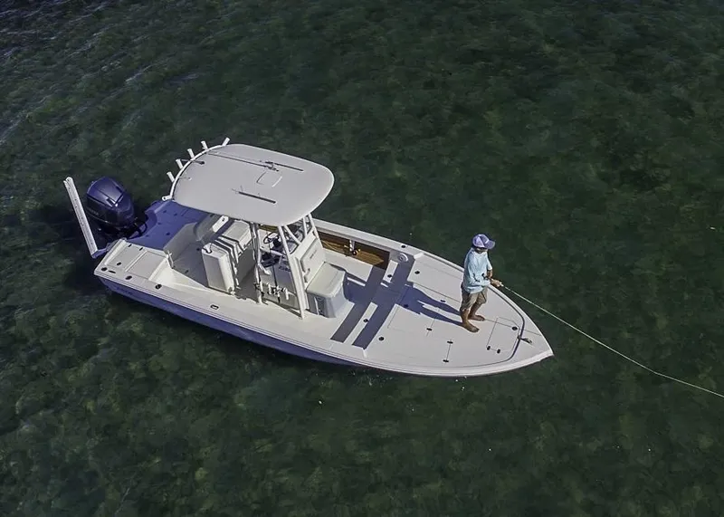 Slide: The Image of 2025 Pathfinder Hybrid 2500 boat with angler fishing in clear waters. - 3