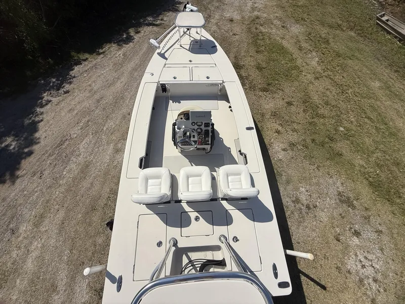 Slide: The Image of 2009 Hewes 18 Redfisher boat, aerial view, showcasing seating and control console. - 19