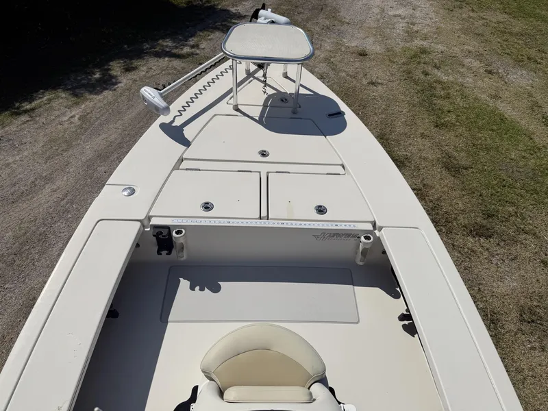 Slide: The Image of 2009 Hewes 18 Redfisher boat interior with seating and storage compartments. - 22
