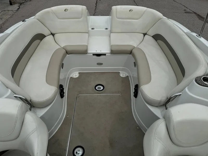 Slide: The Image of 2008 Crownline Bowrider 240 LS interior with spacious seating and beige upholstery. - 10