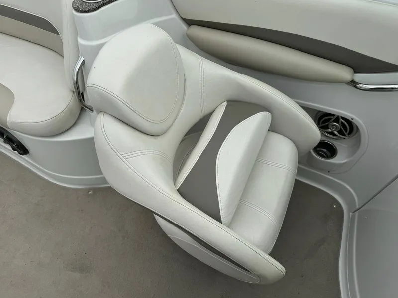 Slide: The Image of 2008 Crownline Bowrider 240 LS interior with white and gray seating. - 14