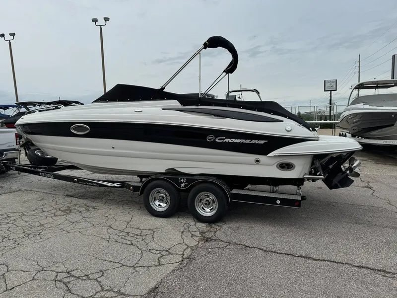 Slide: The Image of 2008 Crownline Bowrider 240 LS on trailer, parked in a lot, side view. - 3