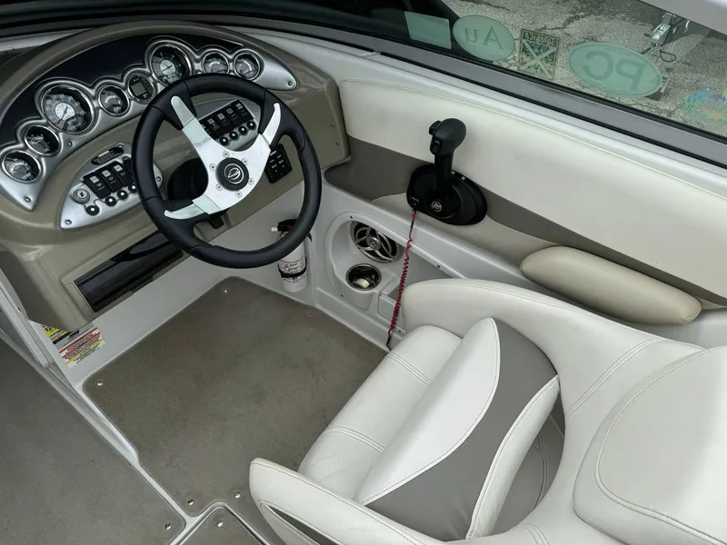 Slide: The Image of 2008 Crownline Bowrider 240 LS cockpit with steering wheel and control panel. - 7