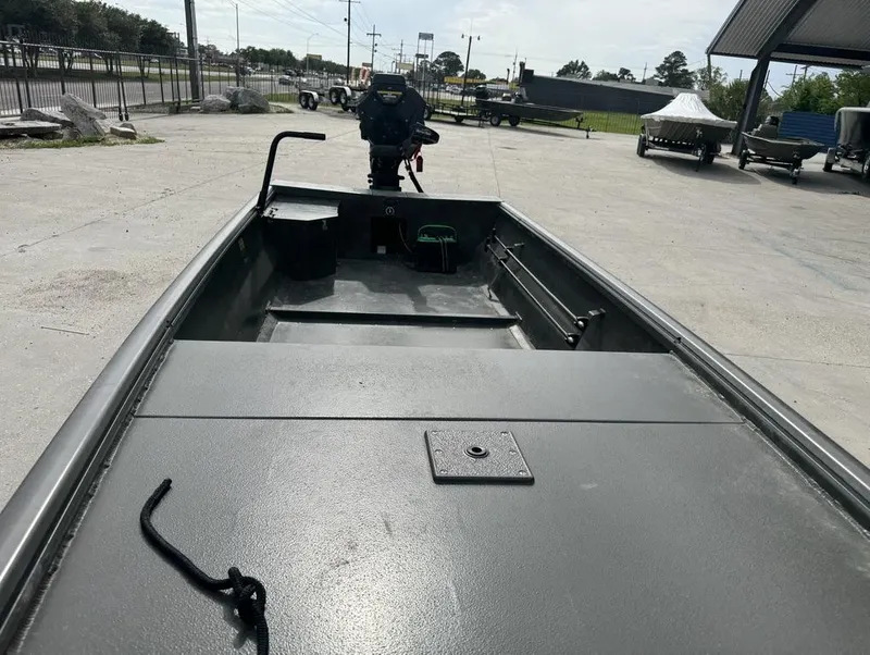 Slide: The Image of 2025 Gator Tail 1748 boat in a parking lot, showcasing its spacious interior and motor. - 10