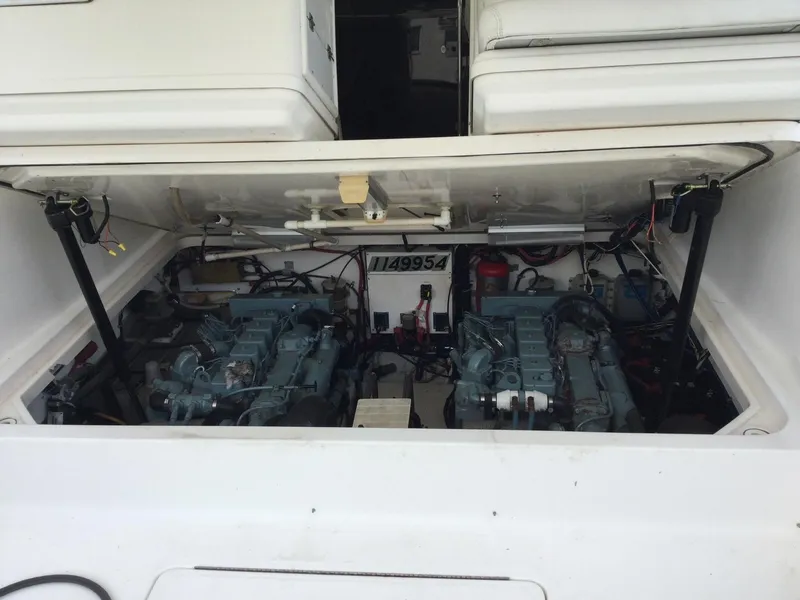 Slide: The Image of 1998 Tiara Yachts 3500 Open engine compartment with dual engines visible. - 8
