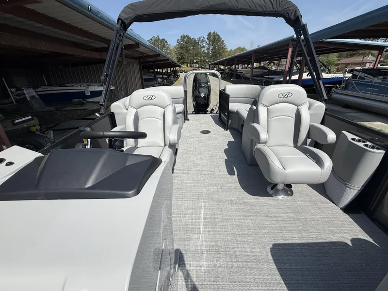 Slide: The Image of 2025 Bentley Pontoons Legacy 220 Navigator interior with plush seating and modern design. - 6