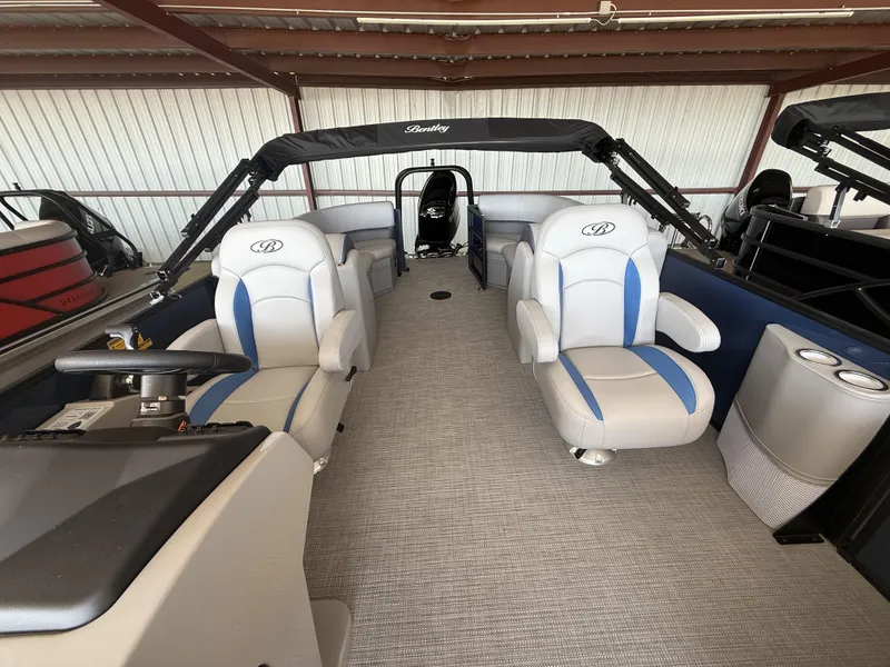 Slide: The Image of 2025 Bentley Pontoons Legacy Navigator 243 interior with plush seating and modern design. - 10