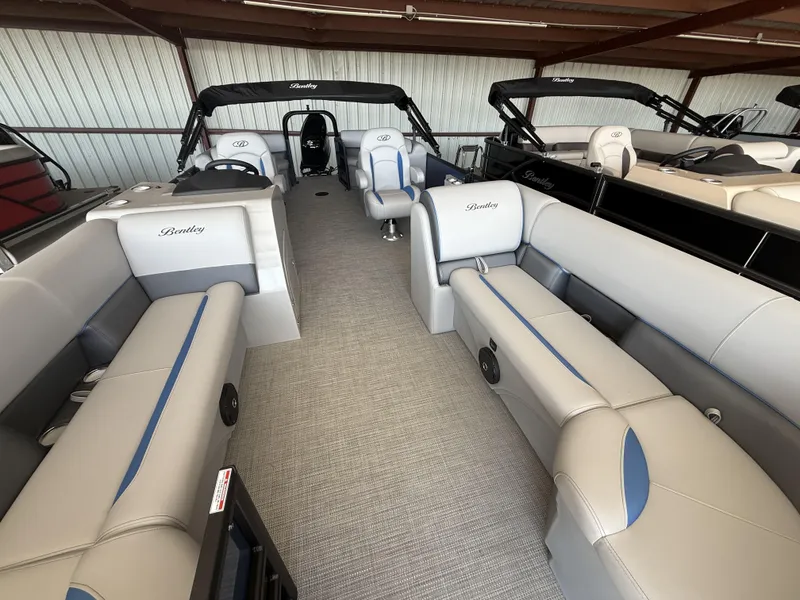 Slide: The Image of 2025 Bentley Pontoons Legacy Navigator 243 interior with luxurious seating and modern design. - 11
