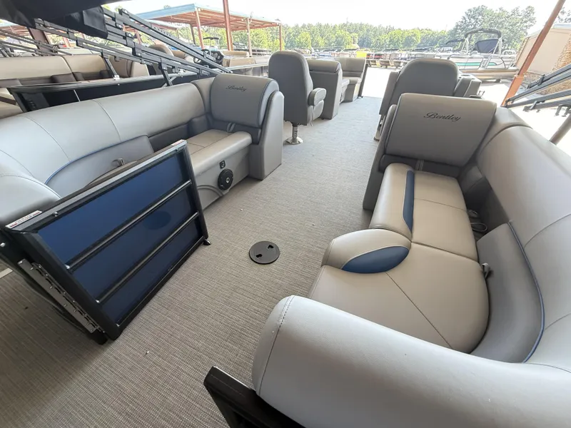 Slide: The Image of 2025 Bentley Pontoons Legacy Navigator 243 interior with luxurious seating and modern design. - 7