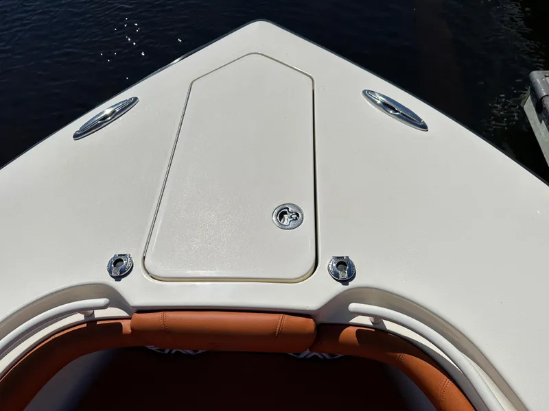 Slide: The Image of Bow of 2017 Scout 320 LXF boat with sleek design and stainless steel fittings. - 18