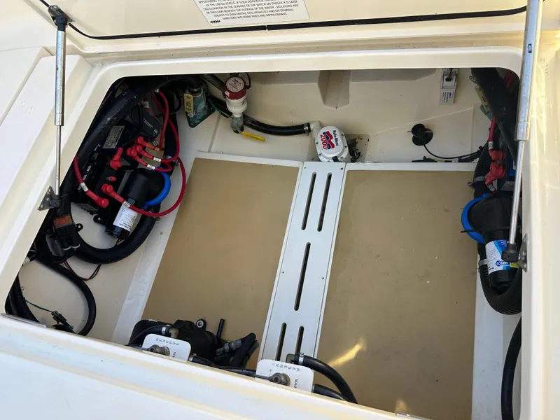 Slide: The Image of 2017 Scout 320 LXF boat compartment with wiring and equipment. - 32