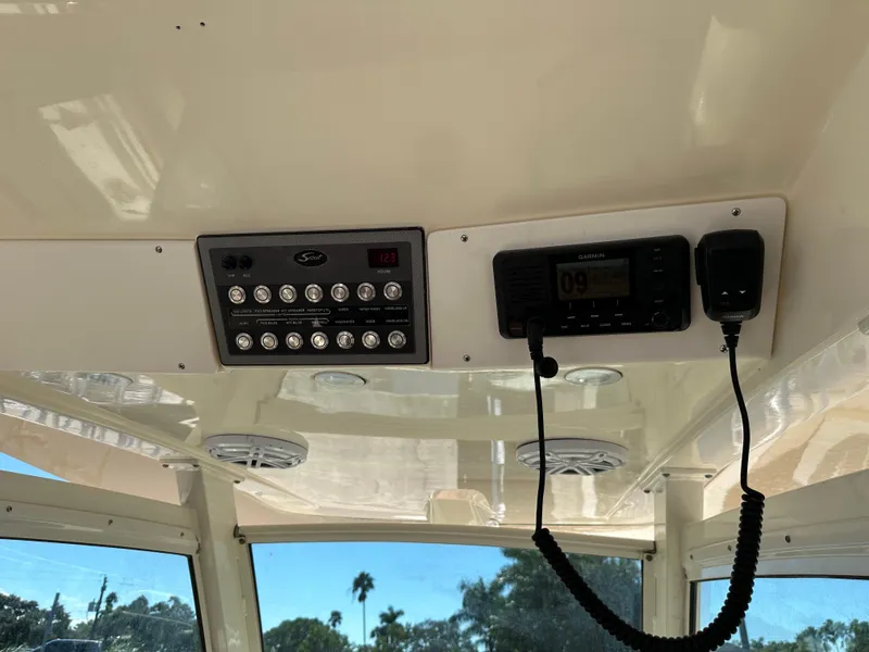Slide: The Image of Control panel and radio on a 2017 Scout 320 LXF boat interior. - 42
