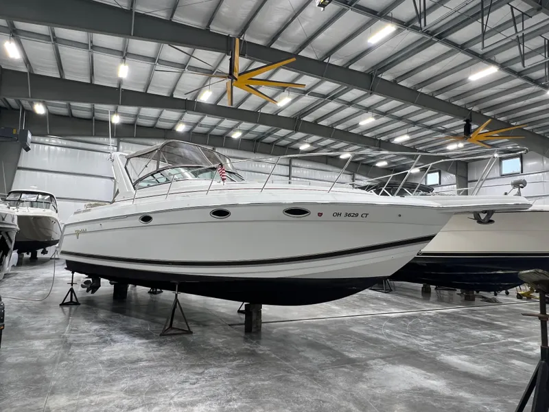 Slide: The Image of 2000 Formula 31 PC boat in indoor storage facility. - 0