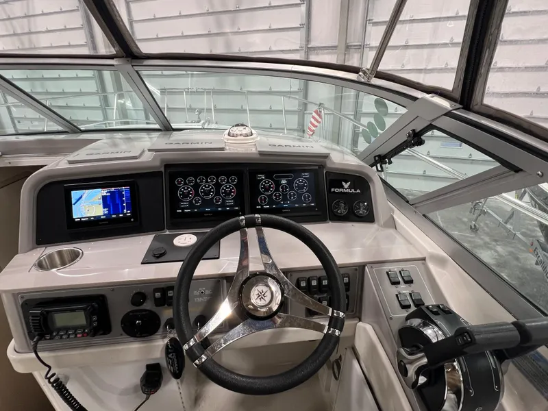 Slide: The Image of Cockpit of 2000 Formula 31 PC boat with modern navigation and control systems. - 12