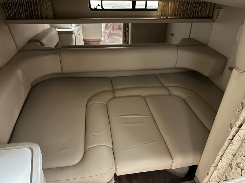 Slide: The Image of 2000 Formula 31 PC interior with beige leather seating and convertible bed. - 18