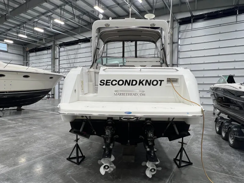 Slide: The Image of 2000 Formula 31 PC boat named "Second Knot" in a storage facility. - 2