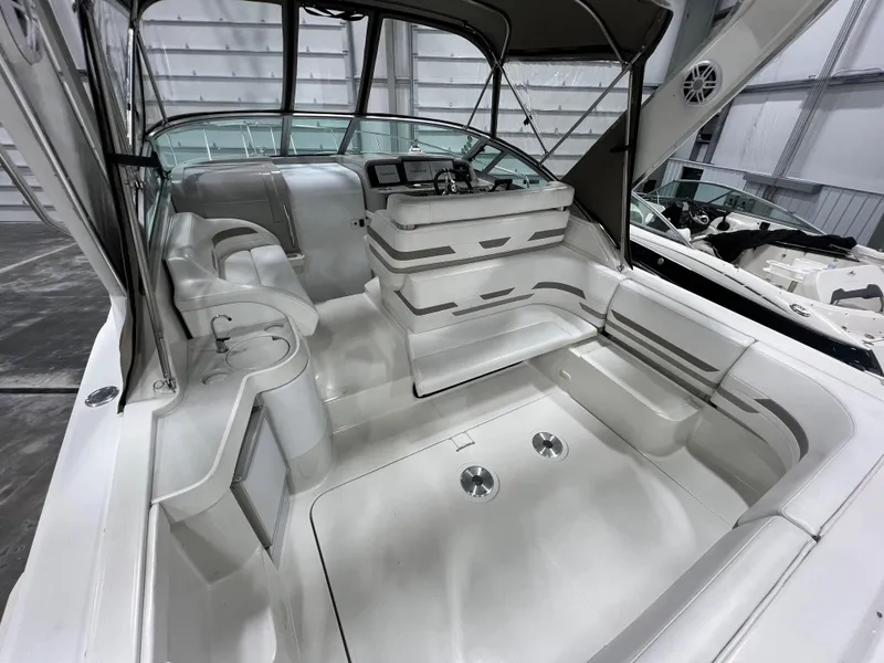 Slide: The Image of 2000 Formula 31 PC boat interior with seating and helm, showcasing sleek design and spacious layout. - 7