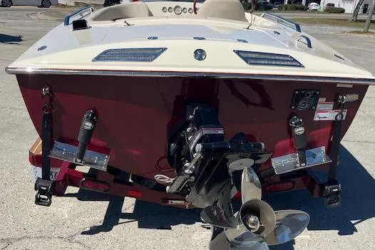 Slide: The Image of 2012 Hornet 17 HiPerformance boat, rear view, showcasing propeller and sleek design. - 3