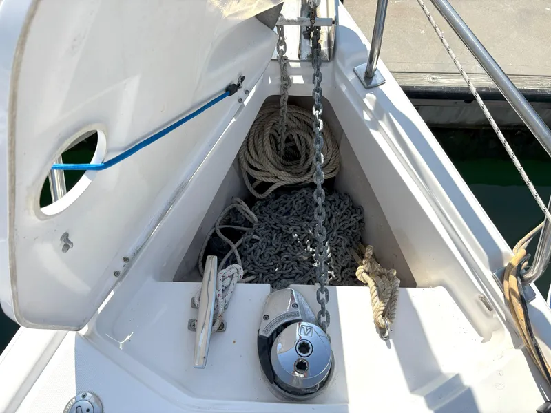 Slide: The Image of Anchor locker of 2005 Hunter 38 sailboat with ropes and chain. - 3