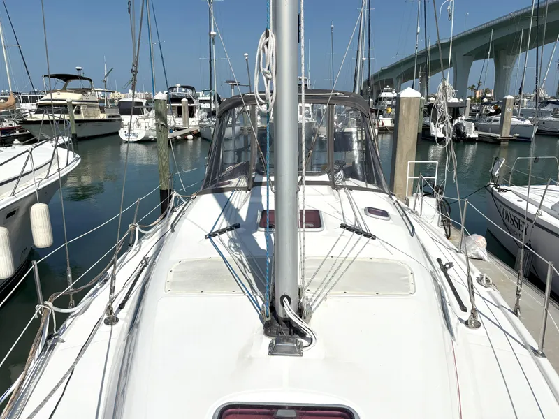 Slide: The Image of Sailboat Hunter 38, 2005 model, docked in marina with bridge in background. - 5