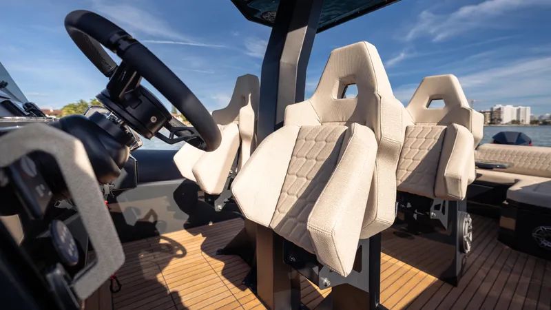 Slide: The Image of Luxurious interior of 2025 Skipper-BSK 38 boat with modern seating and steering wheel. - 5