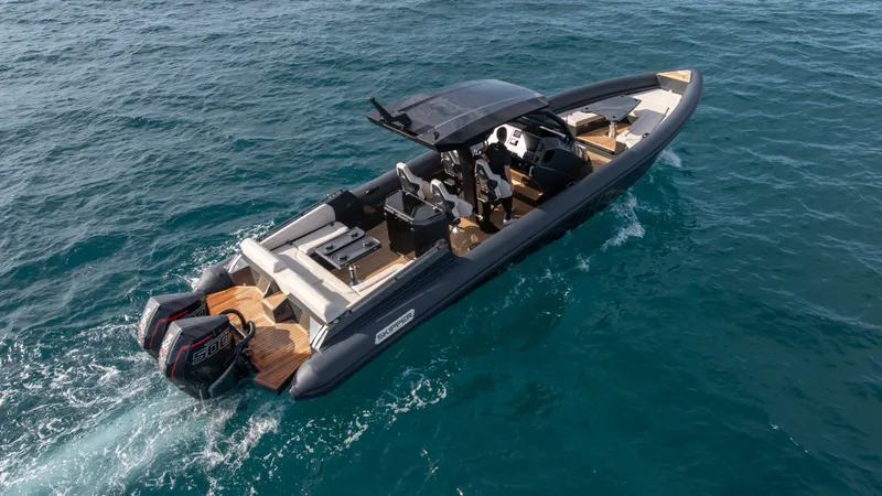 Slide: The Image of 2025 Skipper-BSK 38 boat cruising on open water, showcasing sleek design and powerful engines. - 3