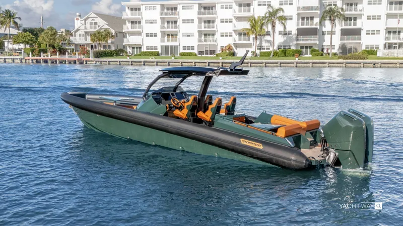 Slide: The Image of Skipper-BSK 38 boat, 2025 model, on water near waterfront buildings. - 24