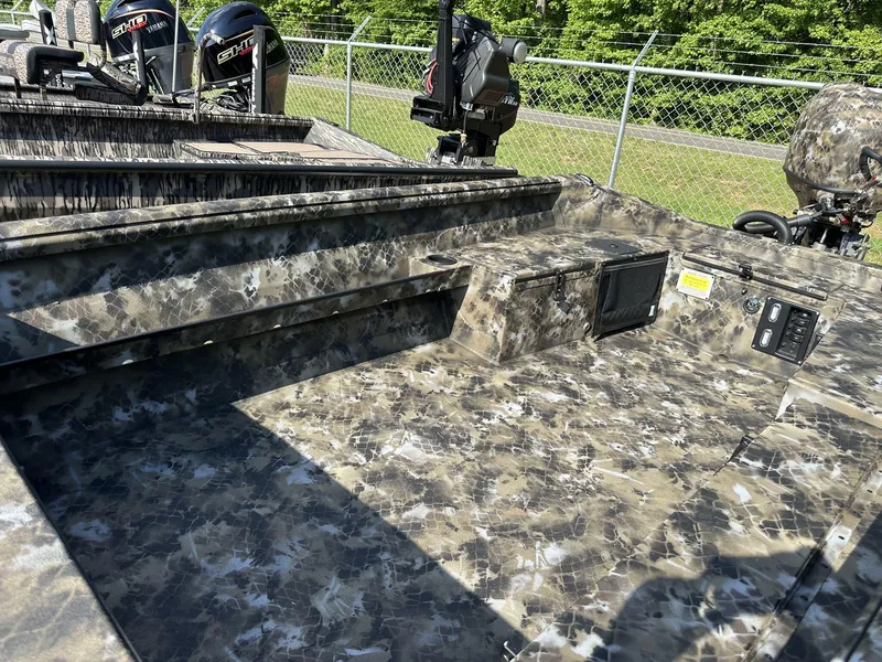 Slide: The Image of Camouflage-patterned interior of 2025 Excel Viper F4 1751 boat with Yamaha outboard motors. - 3