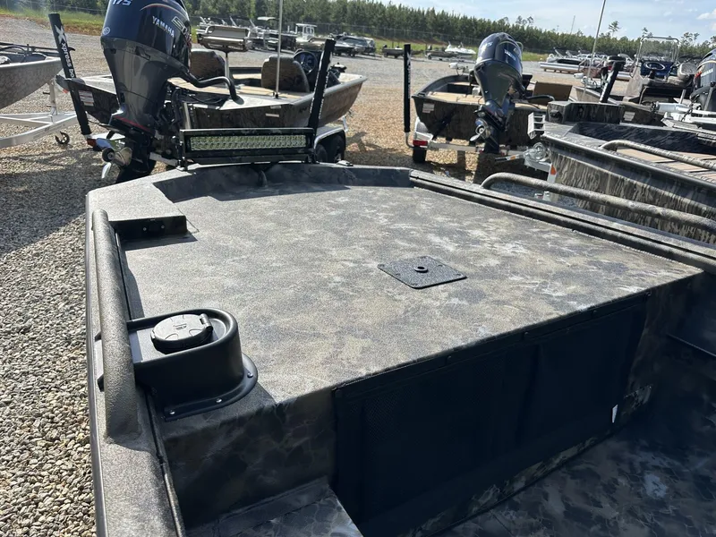 Slide: The Image of 2025 Excel Viper F4 1751 boat with Yamaha motor, parked on gravel lot. - 7