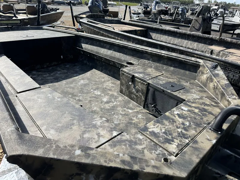 Slide: The Image of 2025 Excel Viper F4 1751 boat with camouflage design, docked outdoors. - 9