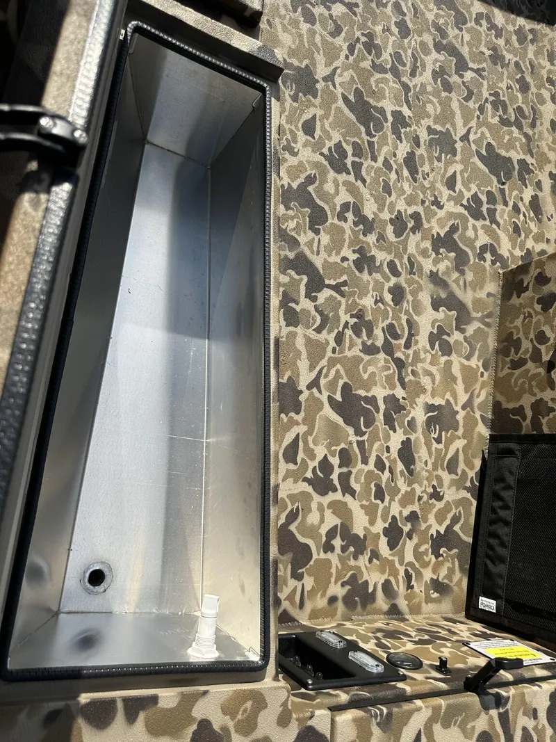Slide: The Image of Camouflage-patterned interior of 2025 Excel Viper F4 1751 boat with storage compartment. - 8