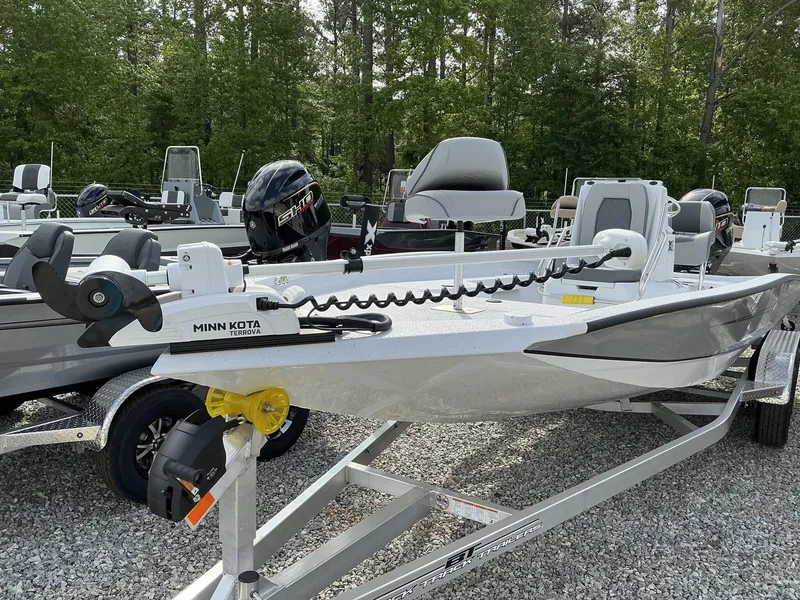 Slide: The Image of 2025 Xpress Hyper-Lift Series H22B boat on trailer, featuring Minn Kota Terrova motor. - 6