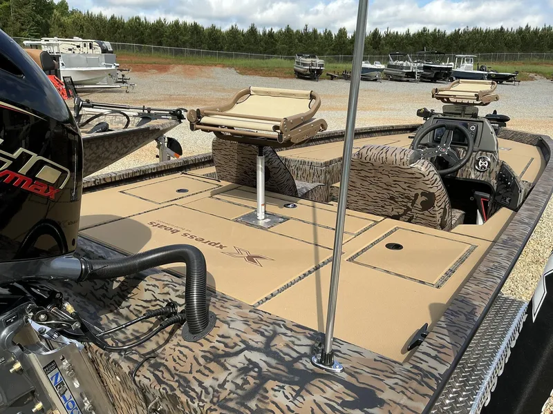 Slide: The Image of 2025 Xpress Hyper-Lift Crappie Series H20 boat with camo design and advanced seating. - 10