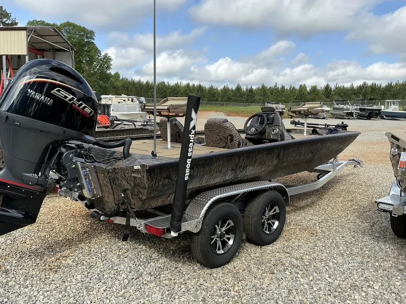 Slide: The Image of 2025 Xpress Hyper-Lift Crappie Series H20 boat with Yamaha engine on trailer. - 11