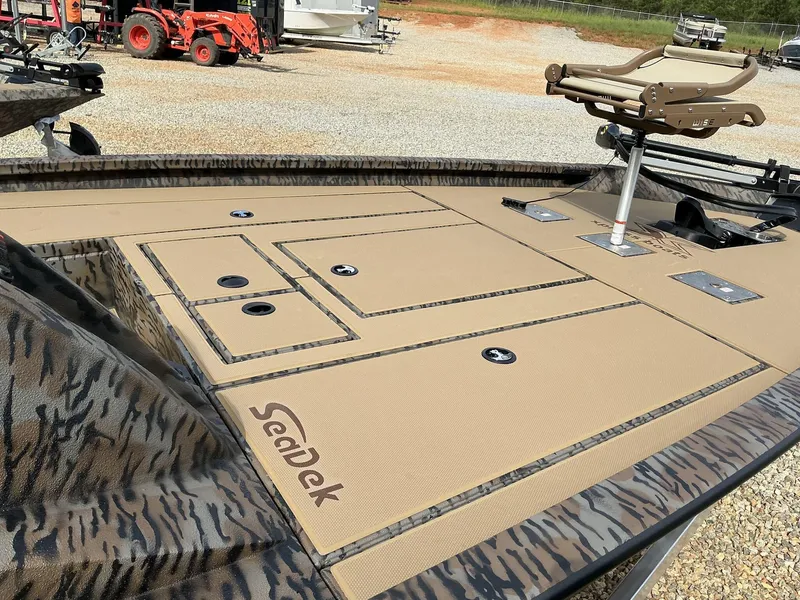 Slide: The Image of 2025 Xpress Hyper-Lift Crappie Series H20 boat deck with SeaDek flooring and fishing seat. - 3