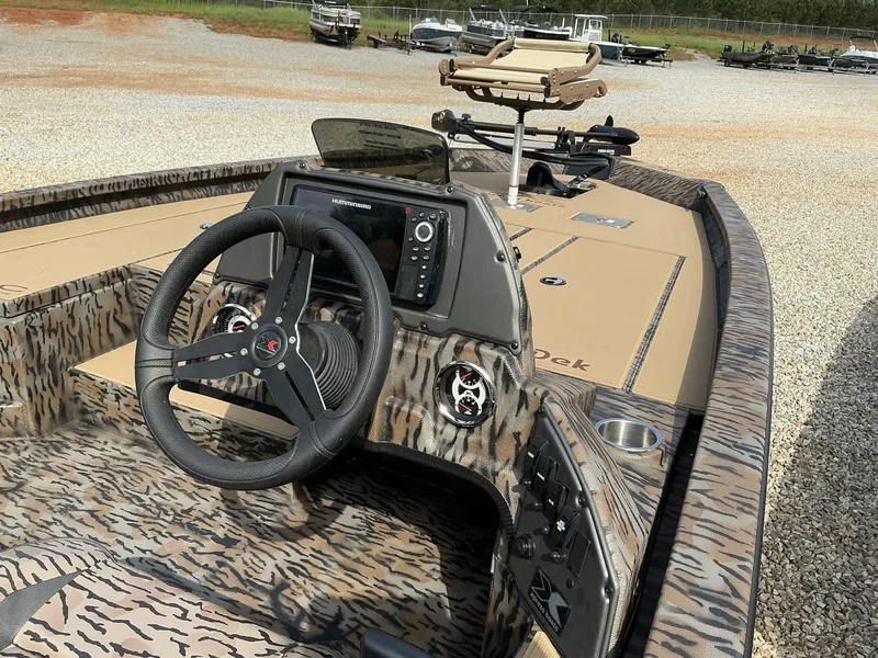 Slide: The Image of 2025 Xpress Hyper-Lift Crappie Series H20 boat interior with steering wheel and control panel. - 6