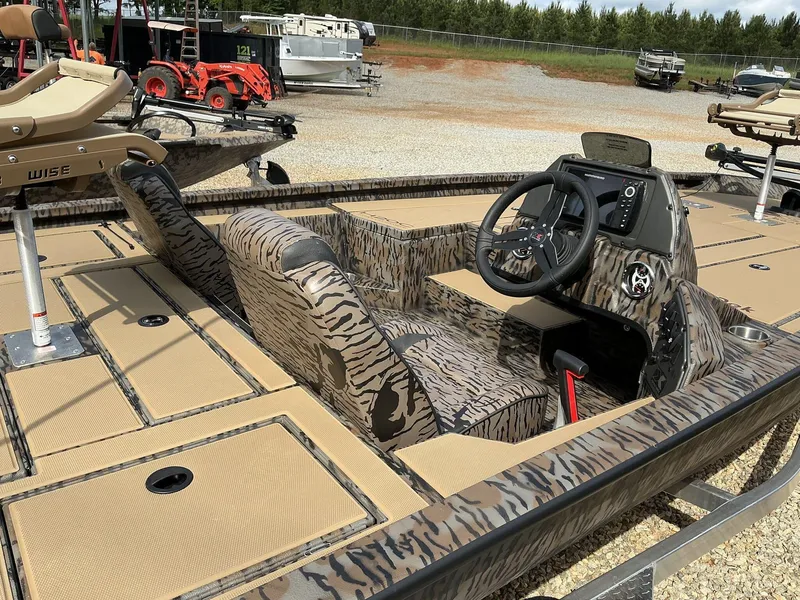 Slide: The Image of 2025 Xpress Hyper-Lift Crappie Series H20 boat with camo design and advanced steering console. - 7
