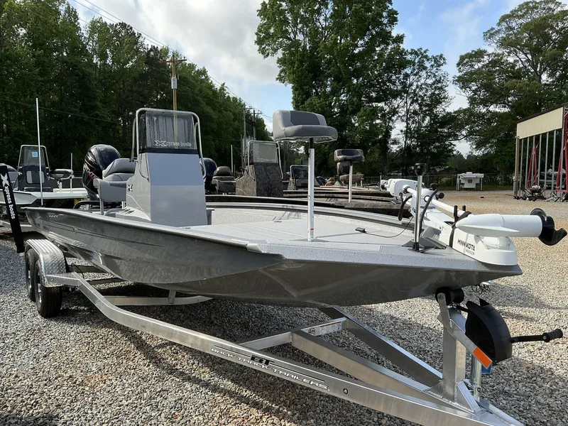Slide: The Image of 2025 Xpress Hyper-Lift Bay Series 210 BAY-175 HP boat on trailer, parked outdoors. - 11